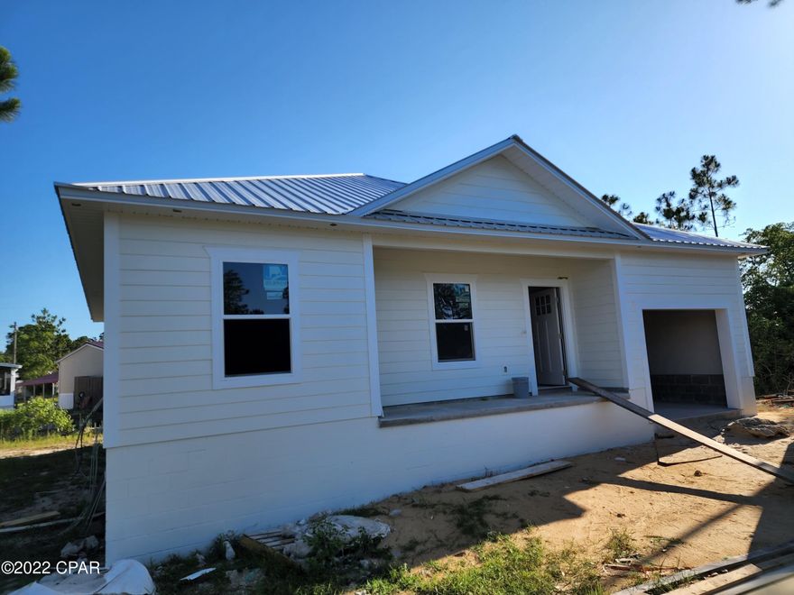 Welcome to Harbour Towne, a waterfront gated community hidden on the east end of Panama City Beach. This beautiful Waterfront Florida Cottage features 3 bedrooms and 2 bathrooms with an open floor plan. The kitchen features all stainless steel appliances, quartz countertops and custom cabinets. This home has beautiful ceramic tile flooring throughout. Enjoy the day on the water and pull your boat right up to your new home on the deep water canal with access to St. Andrews Bay and the Gulf of Mexico. You can host your friends on the back deck overlooking the water. The Harbour Towne Community features a community pool and clubhouse. You won't find many NEW construction homes on the water for under $500K. The Harbour Towne Community is close to the Beaches, Shopping, Dining and Activities.
