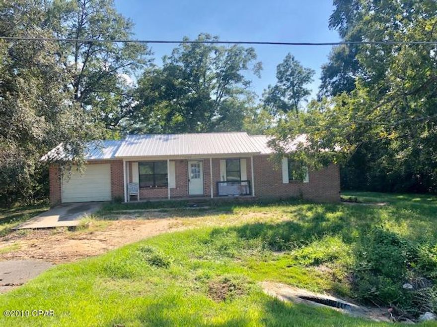 * PRICE REDUCED *  This 3 bedroom 2 bath home is located just on the outskirts of Graceville in a very convenient location.  It has a covered front porch and an attached 1 car garage.   It has great potential with good design.  It has city water and sewer.  Some updates will make it into a great home.