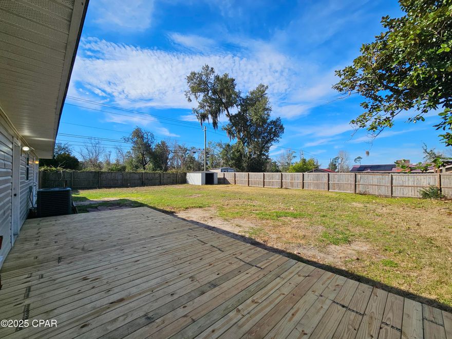 Great Location on this remodeled 3 bedroom, 2 bath split floorplan in Lynn Haven Panama City FL. Solar powered, electric included, fenced yard, brand new open deck and a shed located on a corner lot. Large Master bedroom with walk-in closet and walk-in shower, living room, dining room and nice size kitchen with all the appliances, Washer & Dryer included, and the additional bedrooms are a good size. Great location and schools, close to everything. Ask for your tour today.