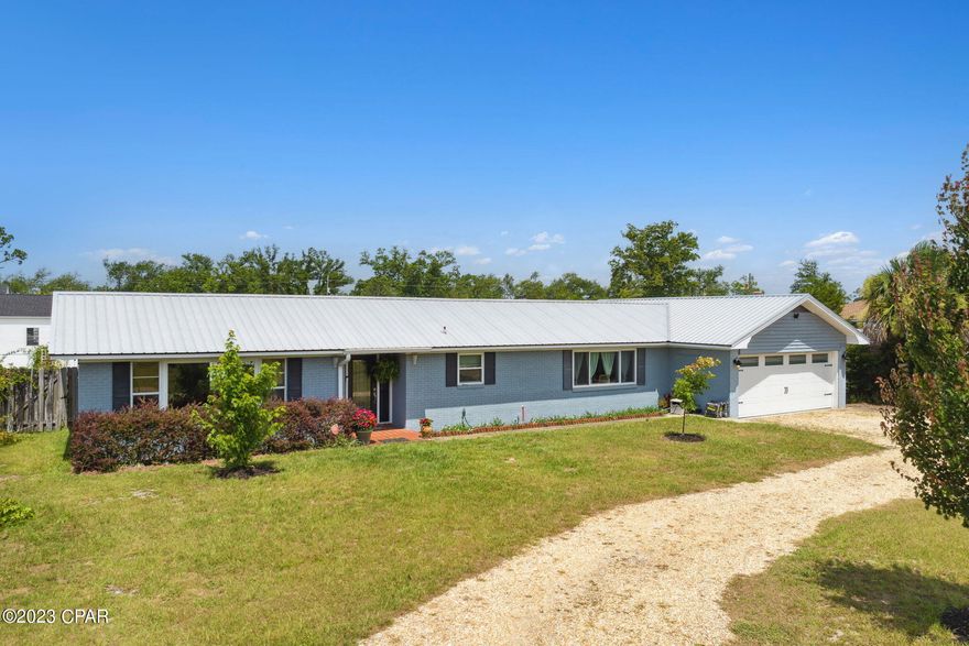 This fantastic home is located in the heart of Panama City and about 800' from St. Andrews Bay.  Enjoy all that Downtown PC or St Andrews have to offer in minutes!  The kitchen has been  updated, has LVP flooring, and stainless steal appliances.  Electrical has been updated as well.  The master closet includes a dream vanity with electrical outlets for all of your hair tools.  The 2 car garage is equipped with hurricane rating door and the roof has hurricane clips.  Two Sheds compliment the back yard.  The ''She-Shed'' makes the perfect art space or craft room as it has electricity and includes a window unit a/c.  Relax under the covered porch in the privacy fenced back yard. If measurements deemed important, please verify.