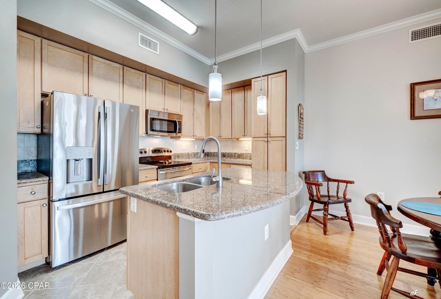The kitchen features an exquisite granite island and countertops, ample cabinet and counter space, and stainless-steel appliances. The private balcony can be accessed from the living room and both bedrooms, making it perfect for entertaining or relaxing at the end of the perfect beach day. The primary suite serves as a true sanctuary, complete with an en-suite bathroom featuring a garden bathtub, a separate shower, and walk-in closet. The generously sized guest bedroom also has an ensuite bathroom offering privacy and convenience for family members or guests. Updates include refrigerator, washer, & dryer 2024, and the shower has been retiled. This second-floor unit is situated steps from the parking garage, no elevator or stairs needed to access your home.
Island Reserve is an exclusive gated resort community offering top-notch amenities, including a luxurious one-acre resort-style lagoon pool, state-of-the-art fitness facilities, billiard and game rooms, a media center with a 100'' theater screen, basketball, and pickleball courts. The courtyards surrounded by lush landscaping and strategically placed benches to ensure maximum enjoyment. The community in centrally located close to popular attractions, dining and shopping options, as well as the stunning Gulfs white sandy beaches and emerald, blue green waters. Don't let this incredible property slip through your fingers! Why wait? Schedule a tour today and see for yourself the amazing lifestyle you could enjoy--reach out to a realtor now to make it yours. All information is approximate and should be verified by the buyer if deemed important.
