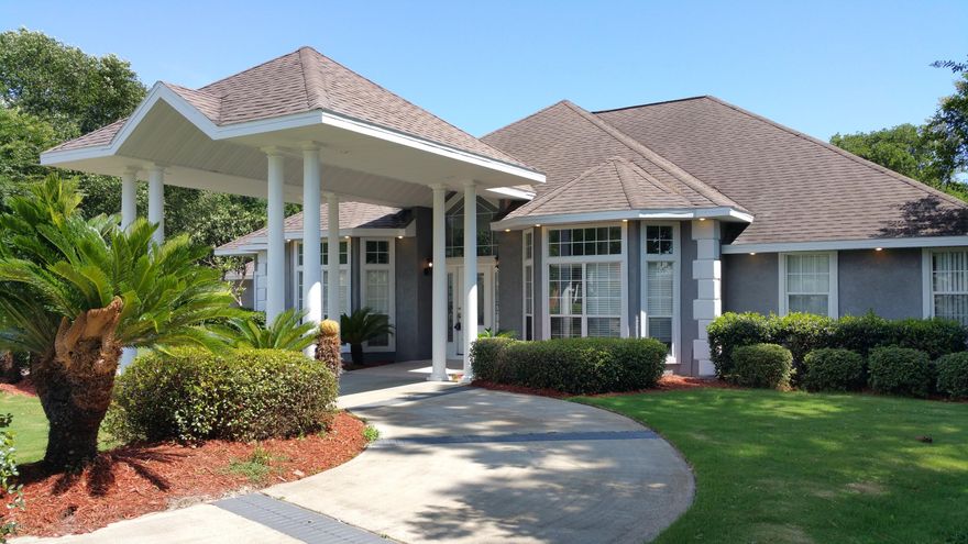 Located in the Woods subdivision situated on a quiet cul-de-sac. This one of a kind, fantastic home provides easy family living and elegant entertaining. The two story portico leads to spacious entry and open living areas featuring fireplace, hardwood floors, architectural ceilings, crown moldings, built in bookcases and beautiful columns. This home has transom windows throughout the downstairs giving it so much natural light and a spacious feel. The kitchen features GRANITE counter top space custom cabinetry and a spacious desk/ office area. Breakfast area, living, family and master bedroom suite all overlook the 15x30 enclosed pool which backs up to a preserve for complete privacy. The master bath features new tile, large double vanity, walk in shower, huge Jacuzzi garden tub, and walk in closet. The large laundry room features custom cabinetry with pull out bins for laundry, and utility sink. In 2003 an additional 2 bedrooms with 2 full baths and bonus room was seamlessly added to this home, perfect for guests, teenagers or in-laws. Other great features include the 3 car garage, 3 zone AC. Recent improvements include fresh paint throughout, removal of dated light and architectural features, new light fixtures. This beautiful executive home is loaded with extras and recent improvements add it to your list of must see homes.