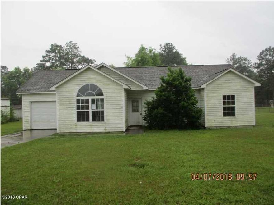 Vinyl sided three bedroom two bath with tile floors, attached oe car garage.  Living room has cathedral ceiling, with open kitchen and dining area.  Seller does not pay owner's title policy, transfer fee and recording fees.  The seller is governed by HUD regulations, the home is sold in AS IS condition, no repairs or concessions will be approved.