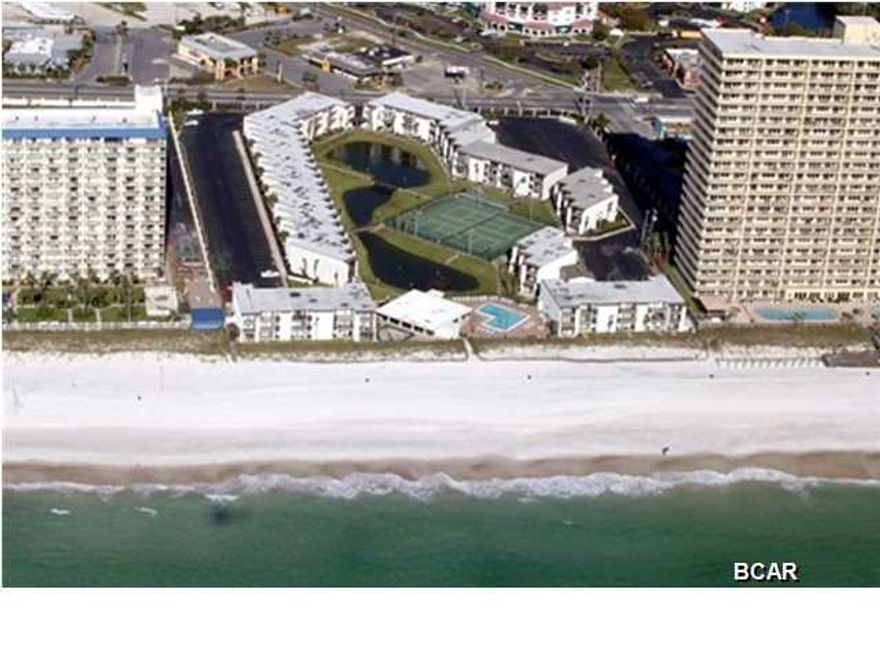 Recently renovated and updated Sugar Beach condo! This fully-furnished, ground-floor unit overlooks the lake and tennis courts. After a complete remodel in 2013, the interior now boasts porcelain 18'' tile flooring, refurbished kitchen cabinets, updated appliances, granite counters in the kitchen and bath, new ceilings with some crown molding and all the fixtures have been replaced. You won't need to do a thing but move in and start enjoying your new vacation hideaway. This is a family-friendly community and you're just steps from all the Sugar Beach amenities which include a clubhouse and pool, tennis and shuffleboard courts, bar-be-cue grills and picnic area, and hundreds of feet of dedicated beach! You're also walking distance from many restaurants and family entertainment venues.