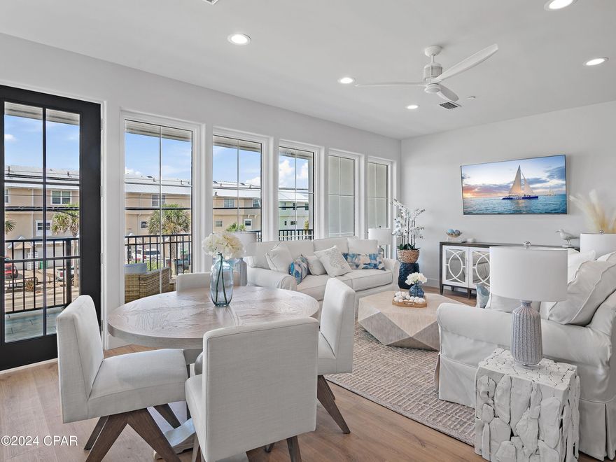 Experience elevated coastal living in this brand-new, fully furnished 4-bedroom, 4.5-bathroom townhome spanning 2,469 square feet, located directly across from the beach in the heart of Laguna Beach on Panama City Beach's serene west end.

Every detail of this residence has been curated for luxurious comfort and refined coastal style. Each unit has been fully outfitted with local designer finishes, blending texture, tone, and quality craftsmanship to create a truly turn-key experience — whether you're seeking a personal retreat or a high-performing rental investment.

Wake up to sweeping gulf views from your primary suite, complete with its own private balcony — ideal for morning coffee or evening sunsets. The thoughtful layout also includes a second primary suite, a spacious king bedroom, and a custom built-in bunk room to accommodate guests in style and comfort.

Inside, enjoy an airy, open-concept living space that flows onto a tiled balcony framed by natural V-groove ceilings. Premium features include GE Monogram appliances, gas cooktop, solid core doors, private elevator, and ensuite bathrooms for all bedrooms. The home is constructed with concrete and wood, with reinforced rebar-filled, 8'' concrete separation walls for added soundproofing and structural integrity.

Additional highlights include a two-car garage, two-car carport, and access to a community pool shared by only five townhomes.

Built to exceed expectations, the home incorporates advanced systems like Gold Bond waterproof sheathing, Schluter bathroom waterproofing, concrete band headers, and an individual fire suppression system — combining peace of mind with enduring value.

Unmatched Location & Lifestyle: Perfectly positioned just a short stroll to Thomas Donuts and Carousel Grocery, this west-end gem is also less than 3 miles from Pier Park — Panama City Beach's premier shopping, dining, and entertainment hub. Explore over 120 stores, Grand IMAX Theatre, Dave & Buster's, and SkyWheel, with exciting new attractions like Topgolf and Dolly Parton's Pirates Voyage Dinner & Show on the horizon.

And when you're ready for more upscale coastal charm, the famed beach towns of 30A are just 15 minutes away, offering boutique shopping, award-winning dining, and timeless Florida beauty.

This is more than a home — it's a lifestyle defined by design, comfort, and convenience. Schedule your private tour today and step into a fully realized beachside retreat.