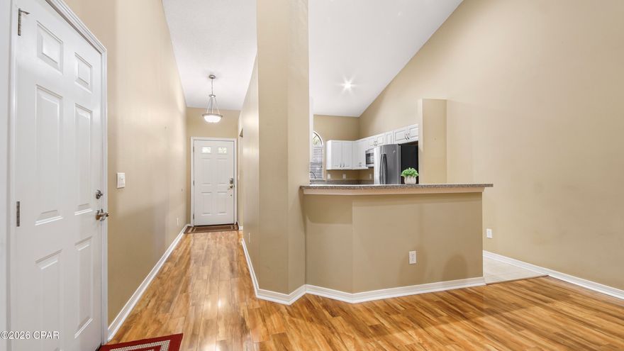 Located in the desirable Palmetto Trace community, this 3-bedroom, 2.5-bath home offers an ideal setting just minutes from Pier Park and the beaches of Panama City Beach. The main level features an open living and dining area connected to an updated kitchen, creating a bright and comfortable space for everyday living and entertaining. The primary bedroom is conveniently located on the first floor and includes its own bath and walk-in closet. Upstairs are two additional bedrooms, a versatile loft-style seating area, and a separate nook that can easily serve as a study or workspace. An enclosed, heated and cooled patio extends the living space year-round, while the private backyard offers a relaxed outdoor retreat. Additional features include a one-car garage with driveway parking, washer and dryer, and central air. Residents enjoy two community pools, sidewalks, and quick access to Frank Brown Park, schools, medical facilities, and daily conveniences. Available now, this move-in-ready home provides a quiet, family-friendly coastal lifestyle in one of Panama City Beach's most convenient locations—schedule your viewing today.