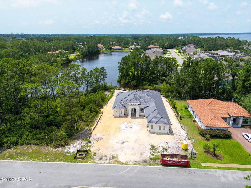 This STUNNING NEW CONSTRUCTION home is currently being built in the much sought after GATED community of Trieste.  This home is perfectly designed for entertaining with the spacious open kitchen and living areas.  The home is adorned with 10-to-12-foot ceilings, a large lanai off the master and living area,  a spacious garage, a 4th bedroom that could be used as an office and a separate den for additional living space.  This upscale neighborhood is known for its Mediterranean styled homes and is just minutes to all the dining, shopping, entertainment and of course the beaches that Panama City Beach is known for. This location also provides easy access to the Holiday Golf Course which is just around the corner as well as a walking/biking trail which is just outside the neighborhood gates. 
All info is approx. and must be verified by Buyers if important.