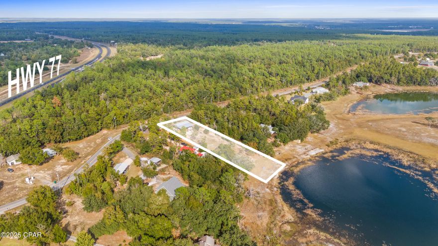 Head start on your new home! Site prep had already started on this beautiful lakefront lot when the current owners decided to move out of state... That means you're ahead of the game in building your own forever home in this prime location! The newly constructed 24' x 48' pole barn with a 20' x 48' lean-to is ready for use to store construction materials or to house your RV while work is underway. There's even a new storage building that's tucked away out of the elements.

Your well has been dug and is outfitted with a Franklin variable speed pump, and your septic tank is already in place. There's even a privacy fence already constructed along the western property line.

You'll love the peaceful setting on Piney Lake, while your proximity to Highway 77 (less than half a mile away) provides easy access to Panama City, Chipley, Freeport -- or virtually anywhere else, from the nearby Northwest Florida Beaches International Airport. The lot's orientation means you can enjoy breathtaking views of the lake and the sunset from your future back porch.

Hit the ground running in 2026 with this lot that's well on its way to hosting your dream home. Reach out today for more details or to schedule your tour of this prime piece of property.
