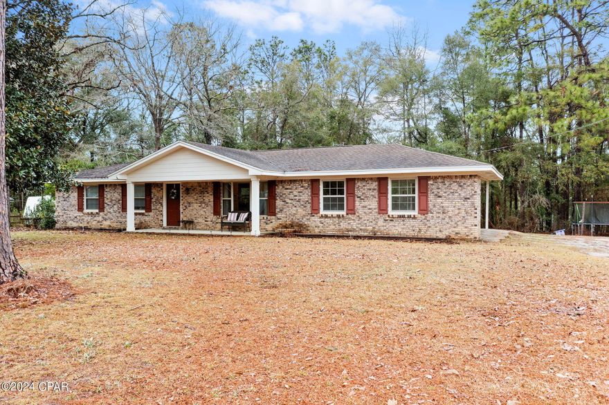 Welcome to this beautiful 3-bedroom, 2-bathroom brick home situated in the serene Dogwood Lake Estates. Resting on a large lot, this property is strategically located across the road from a tranquil lake, affording a relaxing view from the front porch - the perfect spot for peaceful downtime.

Inside, you'll find a spacious living room featuring a large bay window that bathes the room in natural light. The dining area showcases nice vinyl glass sliding doors, leading out to the backyard and extending the living space outdoors.

The home is equipped with two tastefully finished bathrooms, each featuring ceramic tile. The master bathroom houses a well-designed shower, while the hall bathroom offers a convenient shower/tub combination.

Further enhancing this property is a practical two-car carport. With a golf course nearby, this home presents a perfect balance of tranquility and leisure activities. Located in the scenic Dogwood Lake Estates, this property is an ideal choice for those seeking a serene retreat to call home. Don't miss out on this opportunity - call today to schedule your personal viewing!