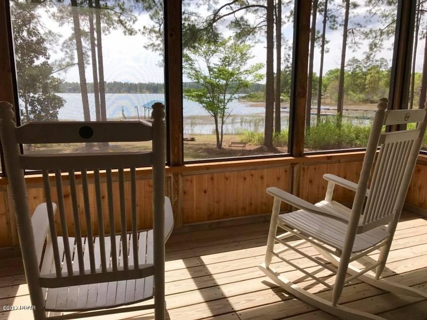 As if the Silver Lake front view isn't enough, you've got to check out this GORGEOUS 4 bedroom and 3 bath home!! It will grab you and not let go!! Has a fully furnished basement, Cedar walls, Hickory and Pecan floors and cabinets! Two AC units, metal roof and comes furnished. Its breathtaking!! Just 30 mins from Panama City and Marianna!! This is two lots with separate parcel ID numbers. The price includes two lots.