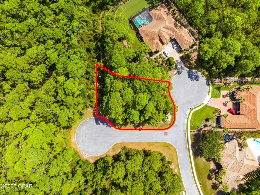 Location, Location, Location! Situated on a desirable corner lot within the beautiful gated community of Trieste, this homesite offers the ideal setting for your coastal retreat. Tucked inside the neighborhood for added privacy, yet just minutes from the best of Panama City Beach living.

Enjoy quick access to Pier Park shopping and dining, the public boat launch, scenic hiking trails, and golf at Legacy Golf Club. Spend your days exactly how you choose — approximately a 10-minute drive to the Gulf's white-sand beaches or an easy 15-minute stroll to the bay.

Whether you're seeking a full-time residence or a second home near the water, this location delivers the ultimate lifestyle: Golf, Boat, Beach, Bay — Repeat!