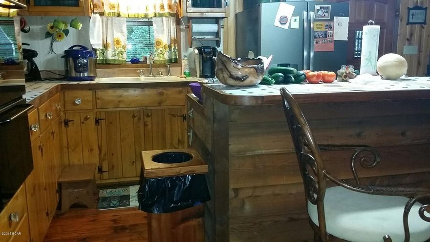 All sizes taken from tax records and appraisal////Very nice secluded log cabin with -MOTHER IN LAW' quarters////apx 12 acres with loads of animals--great place to raise your family.  If you want privacy this place is great////2 or 3 bedrooms with extra living quarters (detached)448sf of efficiency apt/mother n law quarters detached)