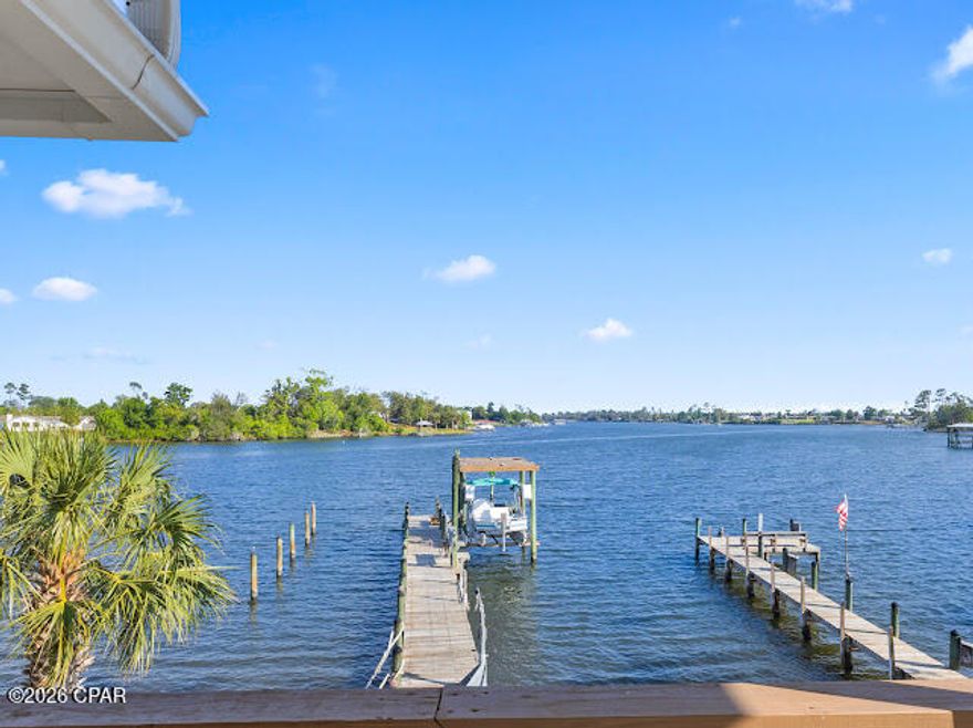DEEP WATER PARADISE!!! 
Welcome to the ULTIMATE coastal retreat where breathtaking views and endless water access come together in one unforgettable property! Nestled at the end of a quiet dead end street, this private oasis offers peace, serenity, and direct access to some of the worlds most sought after waterways. Live here go ANYWHERE!
Boating enthusiasts will fall in love with the deep water access( 8-10 feet apx) and two equipped docks including a boat lift ready for your large boat. With ample space for jet skis and and additional water craft, plus a davit system perfect for lifting a skiff. The dock is designed to accommodate vessels up to 48 feet, making it ideal for serious boaters. The main residence features a spacious 3 bedroom, 2 bath layout with a dedicated office, while a separate guest house provides the perfect potential setup for entertaining or private guest quarters. Expansive porches and multiple decks invite you to relax, unwind, and soak in the stunning surroundings. Enjoy arguably the most spectacular views in town. From your own backyard explore Callaway Bayou, East Bay the Intracoastal Waterway, and the Gulf of America. From your boat dock the St. Andrews Pass is approximately 6 miles or a 20 minute boat ride. This is more than a home it is taking full advantage of living on the coast with a lifestyle where everyday is a vacation. Request your private tour today. ///// ALL MEASUREMENTS AND  DEPTHS ARE APPROXIMATE AND SHOULD BE VERIFIED BY PERSONS OF INTEREST.