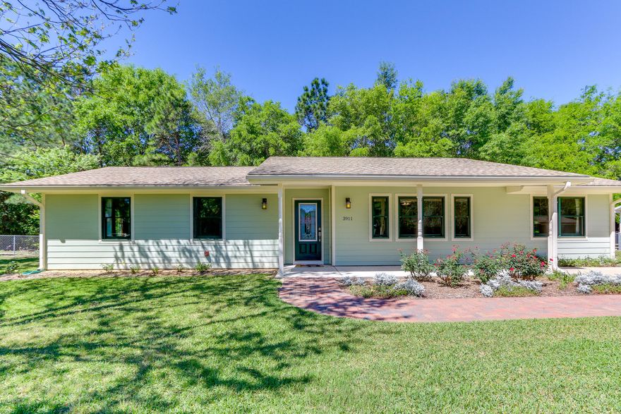 Come view the best kept & updated home in the neighborhood!  This beautiful home features double glazed titanium coated Andersen windows throughout which are double hung and tilt in for ease of cleaning. The kitchen is beautifully fitted with a slide out pantry, easy close drawers, custom designed backsplash, double wall convection ovens, and all high end appliances. The cooktop has two induction burners which make heating super quick.  Ubatuba granite and cabinets that go all the way to the ceiling are the kitchen's finishing touches.  Master en suite has his and her closet. The master bath is wonderfully modernized.  All doors were replaced when remodeled and new carpet and paint have just been updated for the listing period. One of the best features of this home are the bonus areas thoughtfully added by the homeowners; a wonderful office / bonus room as well as a screened porch for additional outdoor living with a beautiful view of trees going down to a fresh water canal.  The laundry room has been updated with an extra refrigerator and extends your kitchen space when entertaining.  No detail has been overlooked - with a two foot eave around the home and fine mesh screening, the home stays insulated from the heat and occasional cold. The roof was replaced 5 years ago and the HVAC 6 years ago and has been serviced bi-annually.  There are many other updates / upgrades not mentioned here - please come see for yourself!  Flood insurance is $700 a year.  These details are approximate and are for informational purposes only.  Buyer must verify details that are important to them.