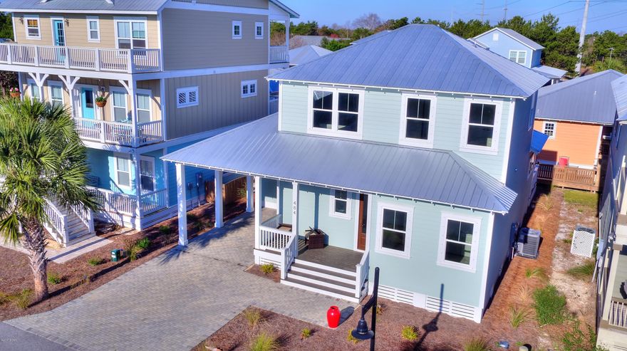 Newly built modern beach cottage is ready to be YOUR new home. Paradise Grove is a small gated community with a community pool on the west end of Panama City Beach, between the entertainment and shopping districts of Pier Park and 30A.  This beautifully crafted home has just about everything a discerning buyer wants. Upon entering the home, you are greeted by the gorgeous hardwood floors in contemporary gray tones. As you approach the fully equipped kitchen with the latest BLACK STAINLESS appliances, you will appreciate the high quality cabinets with autoclose drawers and beautiful high-end Quartz counter tops.  You will also enjoy the wide open space to organize your furniture as you see fit.  The master bedroom suite and another bed/bath are located on the first floor. A true gem. The attention to detail & finishes are key in this home, from the beautiful contemporary light fixtures to the use of quartz for the counter tops in the kitchen and all three bathrooms.  The contemporary craftsman touches take this home to the charm of the 1930's - bright chrome finishes and lever handles on the doors. The gray tones offer a lot of decorating options that will appeal to many.  The upstairs loft can make a great office or study, or just a getaway room to read and relax and watch TV.  The builder has thoughtfully placed outlets on the upper walls where your flat screen television can go or to highlight special artwork. Plus the second floor offers two additional bedrooms and a full bath.  All the closets are left for you to design the way you want them. This home is also very energy efficient with two zones of heating and cooling, more than meeting the standards for insulation;  and with a metal roof - you will have little worry and little maintenace for many years to come!