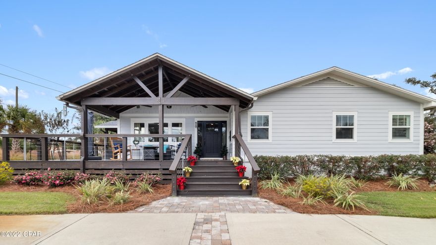 With an acceptable offer, Sellers are offering $5000 toward Buyer's Closing Costs, rate buy-down or to use as needed, as well as an AHS Shield Complete 1-Yr Home Warranty ($825 value). 

Live the life of your dreams right here in 'The Cove'! Don't allow this one to slip by! Built originally in 1954, it was customized and rebuilt essentially in 2019 after the Hurricane, making it a perfect fit for your wish list.

Lounge on your huge outdoor-living wrap around porches and watch the sunset on St. Andrews Bay located just across the street! Also, here you steps away  across diagonally to Adams Park, sitting right on the bay, so bring on the paddle board and kayak! Mixing influences of Craftsman, Coastal and Nantucket, this light and bright home is such a charmer.  The oversized lawn is meticulously planted and maintained on a 1/3 acre corner lot. Invite all your family and friends here with plenty of parking on the front circle drive or the driveway to your 2 car garage out back!
Being a non-HOA community offers you the flex opportunity to use this as your Primary, Secondary or Short-term rental/ AirBNB home. 

Inside you are welcomed into a clean, coastal palette home hosting the original wood floors in the living and dining areas. The spacious living area offers a built-in book casing with a gas fireplace, and leads to the dining and kitchen space with a counter bar, and an amazing walk-in Pantry, including a wine cooler. 

This kitchen is the heart of this home with clean Shaker-style cabinetry, beautiful quartz counters, a white subway tiled backsplash and Stainless Appliances, including a gas range and a 2022 new Dishwasher. 

Off the kitchen is an exit through a screened breezeway porch area to the 2-car garage. Besides vehicle storage, this oversized garage is roomy enough for the laundry area with separate washing sink, an extra Refrigerator/ Freezer, and workbench. In the side yard is a built-on-site additional 'Tough shed' 10 x !0 storage building for all your lawn-equipment, etc. 

The hallway from the kitchen also leads to the bedroom wing, with it ending at an oversized Primary Suite. This is the perfect retreat at the end of the day and spot to wake up in daily. It offers a large walk-in closet with a desk nook. The Primary Suite has a barn door entry to the Primary OnSuite which features separate double vanities and a generous jacuzzi tub, with a walk-in shower and toilet space on its own. 

Enjoy lots of outdoor entertainment ops with an abundance of exterior living spaces at this home. Besides the 10.5 x 28 x 37 porches, out back is a 12 x 20 deck and grilling area, and no excuses for sand in the house with the outdoor enclosed shower, located just behind the garage.

The owners have loved this home and poured their hearts into the maintenance and care of it for decades. It's an essentially 2019 home with all plumbing and electrical updates completed at that time, as well as Alpha foundations extensive reinforcement and climate control work on the foundation - all warranted work. The water heater (2014) has the instant hot water feature, and the HVAC compressor (2017). Energy-efficient foam installation is in the ceiling/ roof.

There are many reasons to love this home and location. It's just a couple miles and in biking or golf-cart (LSV) ride to the historic downtown Panama City, with all the rebirth and growth that is happening. Enjoy the shops, cafes, breweries, and restaurants, plus all of the new growth of the extended area overall with lifestyle elevating options being regularly added. The Yacht Club is only a little over 1/2 mile away. And if Tyndall is your base, here you are only 12 miles away. 

The Cove offers the layers of old, new, innovative, reclaimed, artsy, classy, historic and rich character that are truly rare finds, all adding to the priceless lifestyle to be enjoyed in this community. It's a strong front porch community filled with with friendly neighbors, young and old. It surely is a great place to call 'Home'.

Disclaimer:  All listing details are deemed to be correct but buyer/s are responsible to verify all data shared as needed and desired.