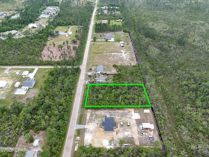 Looking for land but overwhelmed by permits, wetlands, and all the ''extra stuff'' that usually comes with building? This property already has much of the hard work completed for you.

Welcome to 12109 Caruso Drive in Panama City, Florida -- an approximately 0.97-acre homesite with an approved Environmental Resource Permit already in place for a single-family home, pool, garage, yard, and driveway. 

What does that mean for you?
It means the current owner has already gone through the lengthy and expensive environmental permitting process that many buyers don't realize can take months -- sometimes over a year -- to complete. Surveys, environmental studies, wetland evaluations, engineering plans, and mitigation requirements have already been addressed, potentially saving a future buyer significant time, stress, and thousands of dollars in upfront costs. 

Instead of starting from scratch, you can move forward with a property that already has a development plan approved through the state for a homesite with room for outdoor living and a pool. Public water and sewer are available at the road, along with electric access, making the building process even more convenient.

The property offers a peaceful, natural setting while still being close to shopping, schools, dining, and everything Bay County has to offer. Whether you are planning your forever home, a private getaway, or simply investing in land for the future, this parcel offers flexibility and opportunity.

Even better -- the seller is offering owner financing with only $14,000 down, making it easier to secure land now without traditional bank financing.

Build sooner. Skip months of permitting headaches. Save money on upfront environmental work. And start creating your vision on a property that is already one step ahead.