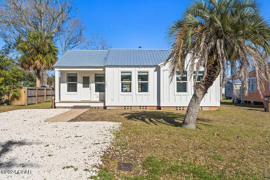 INVESTMENT OPPORTUNITY! COMPLETELY REMODELED 2BR/1BA FLORIDA COTTAGE MINUTES TO ST JOSEPH BAY AND HISTORIC DOWNTOWN PORT ST JOE! Tremendous character and charm best describe this tastefully restored bungalow with luxury vinyl plank flooring and renewed amenities throughout. Arched doorways and the original brick fireplace are standout features adding to the appeal. The classic kitchen design checks all the boxes of a modernized space with stainless steel appliances, natural stone countertops and crisp white cabinetry. Two bedrooms and a shared hall bath provides a cozy place to relax and unwind. As an added bonus, the front entry offers room to create an office space or artist's desk. Situated on an oversized lot there's plenty of room for backyard gatherings or boat parking. In an area with proven income potential, this golf cart friendly community is the ideal spot for long term rentals, a weekend getaway or permanent residence. Capture picturesque sunsets over the bay and enjoy fine dining restaurants, live entertainment and locally owned shops. The community boat ramp is minutes away for a day of offshore fishing or easily launch your kayak and paddle board from the beach. Don't miss your chance to live the beach life! Take the 3D tour and call for a showing today!