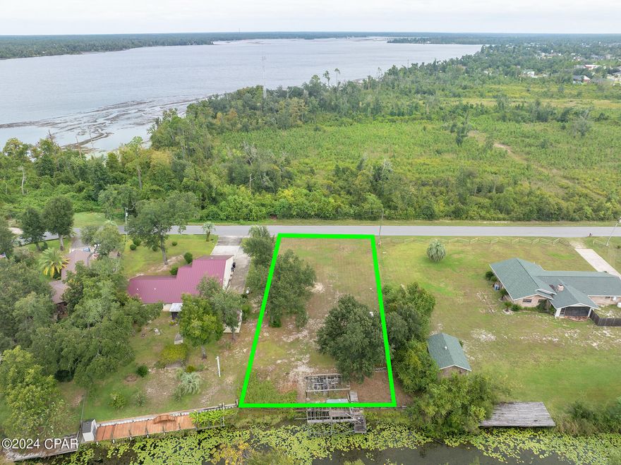 Discover the perfect canvas for your dream home on this serene property just shy of a half-acre. Nestled in a tranquil neighborhood, this lot offers an opportunity with the framing of the previous deck and dock already in place. Imagine waking up to jump on the boat and sail out for the day. Conveniently 5-10 minutes away from Publix on 231, this property combines the best of both worlds: a quiet, private retreat with easy access to everything you need. Don't miss out on this opportunity to create your own waterfront oasis.
