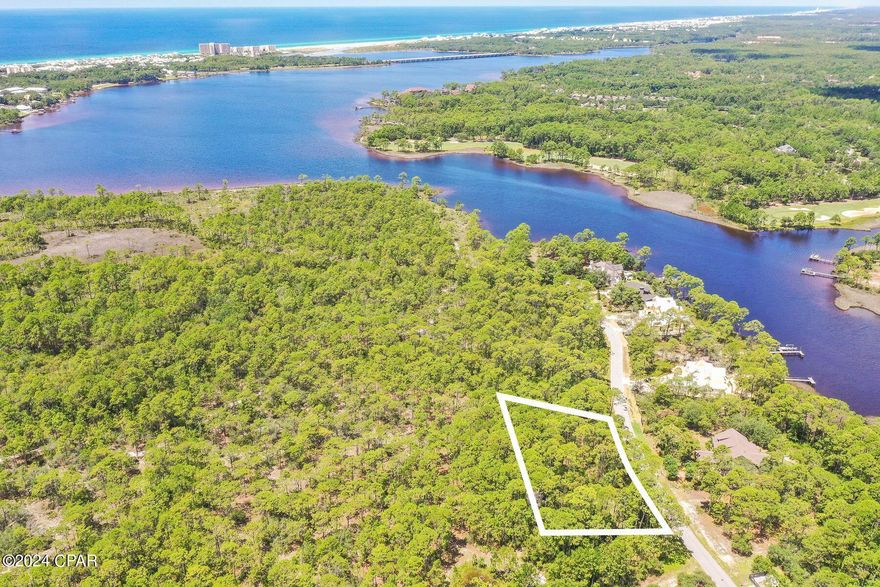 Build your dream home or second home on this large, private lot surrounded by lush vegetation. This highly sought after .54-acre Type A lot is one of only a few of it's kind on the market and is ideally located near the gated front entrance of Wild Heron. It is located in Flood Zone X with no build-out time or flood insurance required. Wild Heron is a 734-acre non-rental Coastal Sanctuary and golfing community located on the shores of Lake Powell at Inlet Beach and Panama City Beach. It has some of the finest community amenities in the Florida Panhandle including 24 miles of pet friendly walking/biking trails, playground, fire pit, heated pool and hot tub, fitness center, and a boathouse stocked with water toys allowing easy access to the lake and white sandy beaches along Camp Helen State Park at the Gulf of Mexico. A new marina with boat slips is currently in the making as well as a new golf course on the north end connecting to WaterSound Origins, bringing more value to the community. Enjoy many community activities including outdoor live music, farmers market, kids movie night, food trucks and more. Memberships to the Sharks Tooth golf course, WaterSound Beach Club, tennis center and more are also available for purchase. Wild Heron is ideally located just minutes to either 30A, Rosemary and Alys Beach or Pier Park in West Panama City Beach, while remaining a peaceful retreat for homeowners. Buyer should verify all data and proximate dimensions prior to purchase.