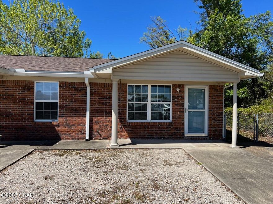 This is a 2 bedroom 1 bath triplex apartment that has new interior paint and flooring.  Laundry room with washer and dryer hook up.  Shared common area back yard, and side by side parking for 2 cars.