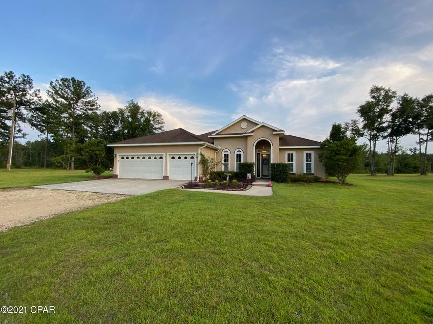 Beautiful 4 bedroom, 3 bathroom turnkey home on 3.7+ acres. This would be a perfect home for a large or growing family, with a lot of space! It features a living room and family room, eat-in kitchen, formal dining room, office and additional sitting room. The master has an en suite bathroom with double vanities, soaking tub, separate shower, and his and hers closets. The other 3 bedrooms are spacious and one has a private  bathroom. The home has hardwood floors, arlo security system with three cameras, sprinkler system, and Gunite enclosed saltwater swimming pool. The AC unit has recently been replaced and this home is move in ready. Located in a deed restricted subdivision. NO HOA The home is situated in a country setting with fenced in yard perfect for children and animals to run safely, but is not far from Marianna and Sneads where there is shopping, dining, schools, etc.