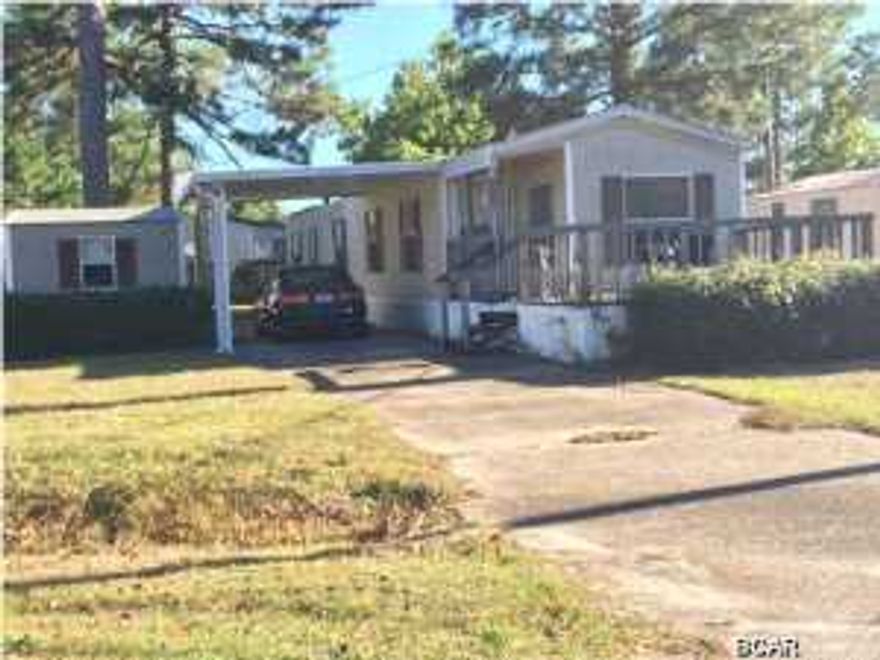 MOTIVATED SELLER & GREAT INVESTMENT OPPORTUNITY!! 2 Bedroom mobile home on Panama City Beach with porch, covered carport and utility building. Home in good condition and could be rental ready in a few days. All information is approximate and should be verified by buyer.