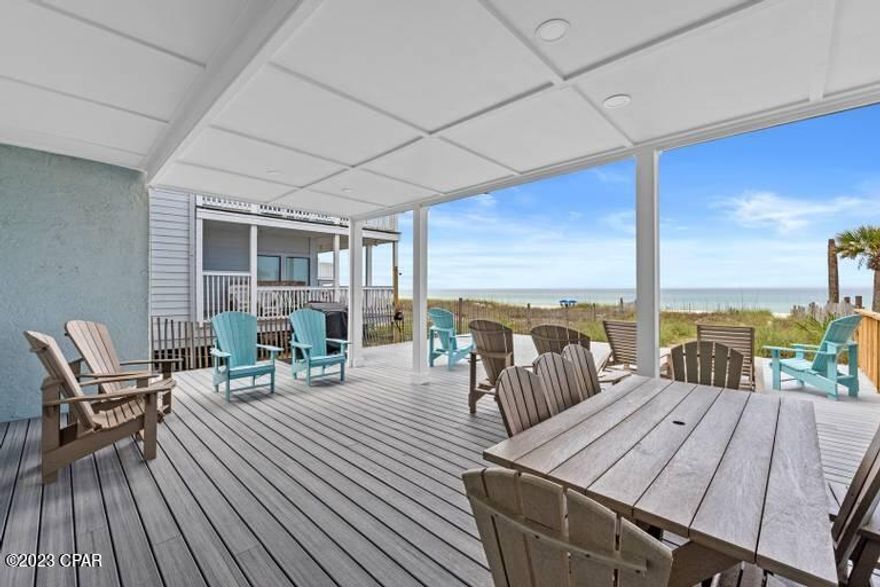 CURRENTLY UNDER CONTRACT, SELLER WILL CONSIDER BACKUP OFFERS - Rental machine with actual rental numbers and future bookings.  2022 gross rentals were $118,000 and so far for 2023 gross rentals are $110,000. This beautiful beachfront townhouse was totally renovated in November 2022 and is turnkey rental ready and no HOA fees.  It is an end corner townhouse that offers 26 feet on the water.  Amazing sunset views from the huge oversized back deck that is 24x38 feet of which 15x24 is covered and waterproof.  Full waterproofing of the area underneath upper deck for outdoor lower seating.  All materials waterproof PVC composite board.  The master bedroom is beachfront with access to the upstairs deck.  Brand new AC compressor and air handler 6/27/2022.  Brand new Trex upper deck in 2021 and brand new Trex lower deck, March/April 2023.  The exterior was upgraded to hardy Board in 2021. Many upgrades and a great investment property.  Call to see today.