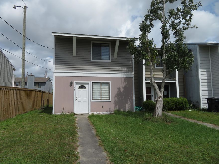 Looking for a project/investment?  This townhome is a fixer upper after hurricane damage and is  being sold ''As Is'' at a great price!  Downstairs is the living area and half bathroom.  Upstairs is 2 bedrooms and a bathroom.  One of the bedrooms has a balcony to sit outside overlooking the backyard.  Seller is motivated!