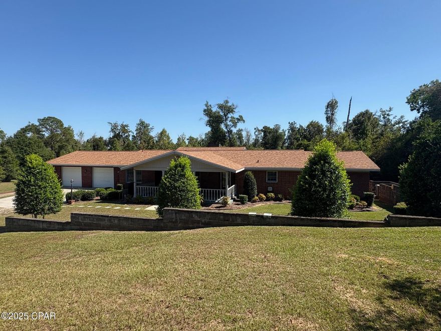 LOCATION, LOCATION, LOCATION!! This home sits just blocks from the new Marianna K-8 School, Marianna High School, the City's sports complex, Citizen's lodge Park, Chipola River with boat ramp and much more. Country living on approximately 7.4 acres in the middle of everything. The home is privately sitting in the center of the acreage oofering privacy and room for gardening, chickens, ect. For the man cave/shop/garage there is a detached 24 x 36, with roll up door and 22 x 22 area with a half bath, water, electricity and septic.
Th home has approximately 3555 h/c sq ft, 3 Bedrooms/3 full baths. formal livng room and dining room with real hardwood floors, huge family room with large stone firplace, a master bedroom suite with whirlpool tub, separate shower, walk in cedar lined closets and much more. The sun porch has a built in jenn aire down draft grill for entertaining. The home is currently hooked up to BOTH public water and well water. Use the well and in emergency situations flip a valve and have public water.
