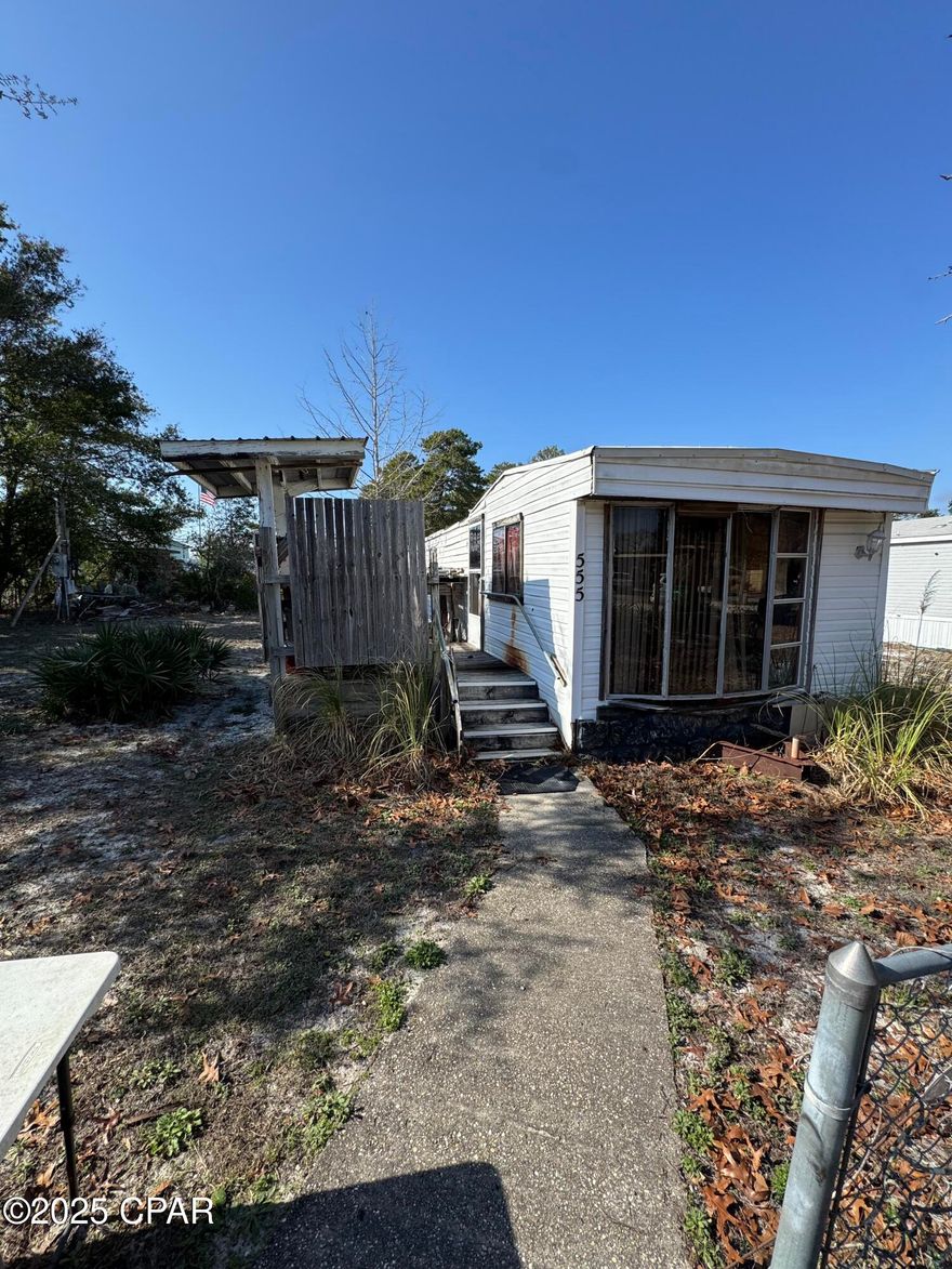 CURRENTLY UNDER CONTRACT, SELLER WILL CONSIDER BACKUP OFFERS-Prime West End Location - Build Your Beach Dream! Great property for investors.

Discover the perfect opportunity to build your dream beach home or investment property in the highly sought-after West End of Panama City Beach! This expansive  lot—just over a quarter acre—offers plenty of space for a pool, duplex or a spacious single-family retreat.

Located just blocks from the sugar-white sand and emerald waters, this golf cart-friendly community of Laguna Beach boasts a laid-back, coastal vibe. Enjoy easy access to local favorites like Thomas Donuts, Carousel Grocery, Pier Park, and 30A. With zoning for short-term rentals, this property is ideal for a primary residence, second home, or lucrative investment opportunity.

Ample parking is available for boats and RVs, making it a true beachgoer's paradise. Trailer on-site is uninhabitable and unavailable for interior access.

Don't miss this incredible chance to own a piece of paradise on the West End!