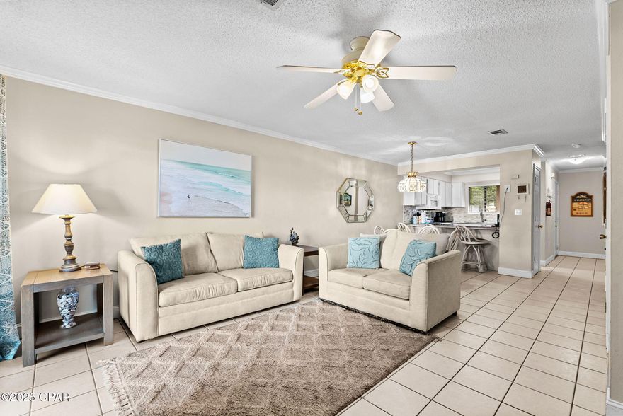 MOTIVATED SELLERS! THIS ONE IS PRICES TO SELL! Welcome to Portside Condos! This 2 bedroom/1 and a half bathroom townhome-style condo is a turn-key property is ready to reel in the rental income. When you enter this home, you'll enjoy the open concept living, dining and kitchen space. The laundry is located on the main level along with a half bath. The kitchen is equipped with granite countertops and a beautiful tile backsplash. Upstairs you'll find two spacious bedrooms and a half bath. The primary suite features an awesome balcony off the bedroom! Out back, you'll love the storage closet perfect for storing beach toys and accessories right at your fingertips! Portside Condos is right across the street from public Beach Access 71! Portside is home to an abundance of amenities that include a kiddy pool, a spa (hot tub), one heated pool and two additional non-heated pools, tennis courts, and a clubhouse for owner/tenant use! Portside is also located on the West End of PCB, only minutes from shopping, dining, and the many other amazing attractions PCB has to offer. Come check it out!