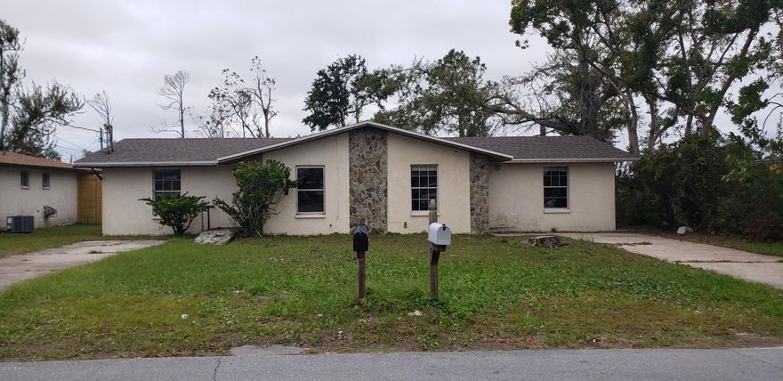 New Roof!!! Block Construction!! Has been thoroughly dried out. Duplex with tons of potential. Great investment property as rentals or for a home owner who would like to live in one and rent out the other. Each side has it's own driveway. Large back yard. Each unit has 2 bedrooms and 1 bath. Each unit has it's own laundry room. Roughly 820 sq ft each.