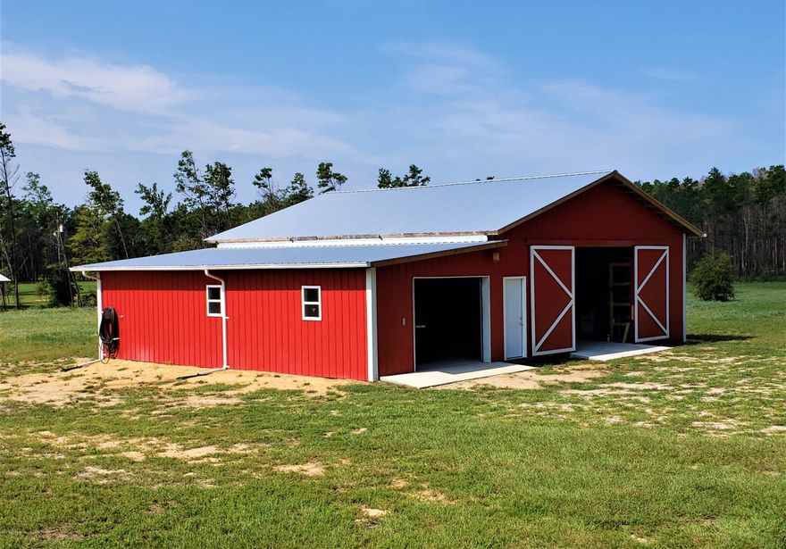 Back on thre market! Financing fell through... Lookng for a wonderful property w/acreage & barn close to Crystal Lake?  Well look no further!  This property boasts 5 ac of land w/well maintained 2015 doublewide & large 36x46 Pole Barn. Attractive decks (one w/a ramp) on front & back of home.  Open floor plan w/split bdrm layout & office.  Wood looking vinyl & carpet installed throughout. Lg kitchen w/wonderful island breakfast bar & separate pantry.   Refrigerator & flat top stove stay w/home.  Master bdrm is nice sized w/en suite bathroom featuring separate shower, soaking tub & double vanity.  Home constructed in 2015 but placed on land in 2016.  Pole barn constructed within the last year featuring cement floor, hoist, 10x12 ft doors, 200 amp service, water & keyless entry. Fruit trees in back w/an area set aside to play horseshoes.  New septic 2015 & Roof is approx 3 years old.  Furniture & equipment negotiable (w/exception of tools).  Even the tractor is negotiable.  No known hurricane damage!