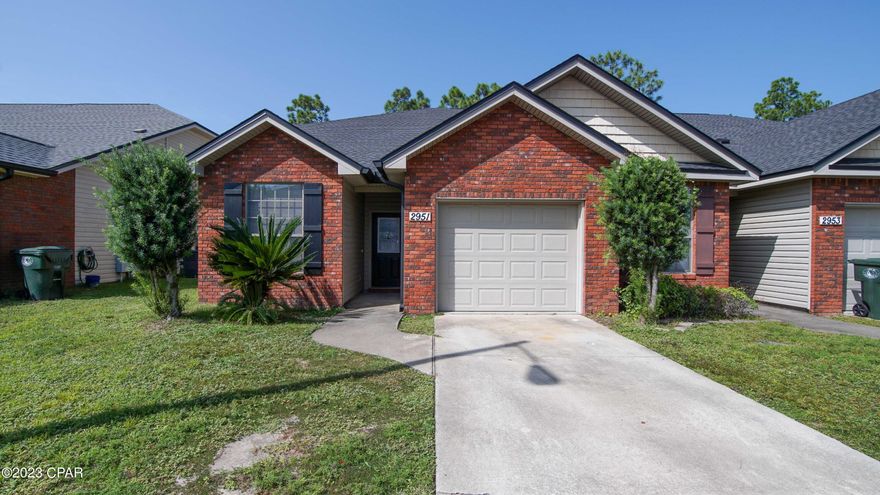 Spacious 4 bedroom, 2.5 bath townhouse located in the heart of Lynn Haven; surrounded by lush woods! Master bedroom is on the 1st floor with ensuite - soaker tub, separate shower and walk in closet. Living room, laundry room, 1/2 bath, kitchen and eat in breakfast nook all on first floor with 1 car garage. There are 3 bedrooms and a guest bathroom upstairs! Lawn maintenance is included in rent! There is a security system that tenant can activate if they choose to. Additional guest parking is conveniently located just across from the unit, providing ample space for extra vehicles. This townhome is in a prime location—close to shopping, restaurants, schools, and more. HOA fees cover lawn care and street lights