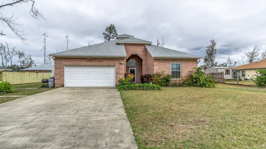 This custom built, all brick home has 3 bedrooms/2 bathrooms and is located on a large lot. There are many architectural details to include theater lighting in entry and living room, gorgeous ceiling fan, block windows in living room/entry/master bathroom, hurricane code double pane windows, new R44 attic insulation, hybrid water heater and TOTL American Standard Platinum heat pump. Kitchen features ample custom cabinetry, granite countertops, tiled backsplash and corner sink. Kitchen overlooks living room and dining area. Master suite offers tile flooring and master bathroom with walk in shower. Guest bedrooms are spacious and share a full bathroom. 1 mile from Deerpoint Lake boat ramp. All sizes/info/measurements are approx; please verify if important!