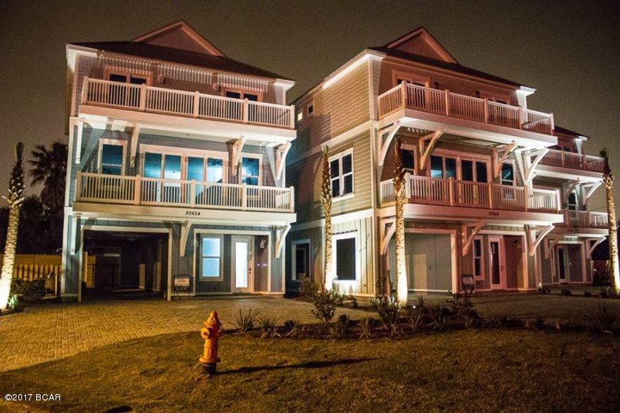 Just dropped listing price by 100,000.00  Owner is ready to move it.  Great New Beach house.   Coastal Charm was the Decorator and the unit is complete with  rental package and on rental with established income.     6 bedrooms, 6 1/2 baths,  3385 square foot with a fantastic outdoor area with private pool and outdoor cooking area.  Dedicated beach and public beach access rigth across the street.  Great established income.  Approved for commercial financing as well as residential, Several banks have preapproved the property.  Great investment with great growth potential.