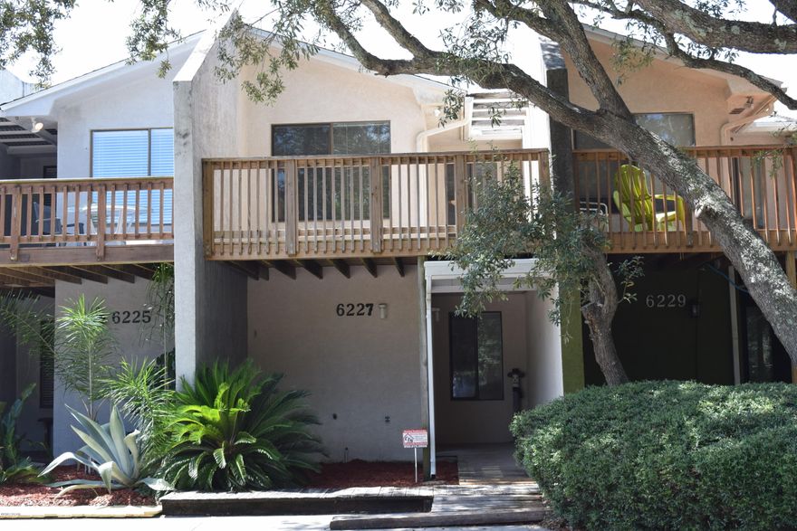 Whether you're looking for a vacation home or the beach life year round, this townhouse is perfect! Located down the street from a boat ramp on the Lagoon and a few blocks from the beach, this is Panama City Beach living! The first level has a spacious bedroom and bathroom, large walk in closet, washer/dryer hook up and sliding glass doors that lead out to the very private yard with an 8 foot wood fence. Also on the first floor is a bonus room that can can be used as a family room or 3rd bedroom. On the second floor is the main living area and another bedroom and bathroom. The living room, dining area and kitchen is one large open space with lots of natural light. Step out to the spacious balcony and enjoy the water view. Lots of room for outdoor entertaining! This unit is in good condition and was lightly used by family. It was not a rental property.The roof, water heater and septic system were all recently replaced (about 2 years ago). The air conditioner installed 2012.