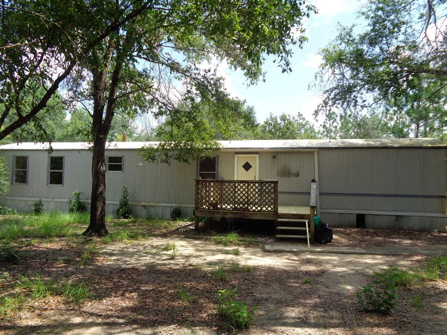 Single Wide Mobile Home on large lot. New Paint and new carpet. Fenced yard.