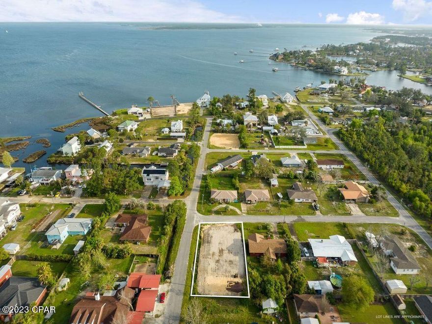 Build your home on this incredible corner lot that is prepped and ready to begin construction - just steps from the waters edge! This homesite with NO HOA is nearly 1/4 acre and centrally located off 23rd Street to shopping, dining, parks and more. 

A public boat ramp is less than 1/2 mile from the homesite and lends to the perfect boating waterfront lifestyle at a fraction of the cost. 

The lot has been prepped and brought up to 1' above the crown of the road. Water tap has been paid. New septic system has been installed. 

The seller has architectural building plans and engineering plans for a 1,072 SF home that will convey with the purchase of the lot. The home offers a single level with three bedrooms, two bathrooms. Ideal for a buyers personal home, perfect for an investment property for rental or a developer who wants to build to sell. Inquire today on this development opportunity in the center of Panama City!

Home in photos is a virtual rendering of a completed home. The home plans convey with the property. Home is not built and completed home is not included in the purchase price.