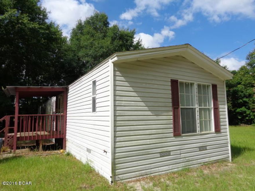 OWNER WILL FINANCE WITH $20,000 DOWN PAYMENT. Great investment property. 2 SW MH's, 2 septic tanks & one 4'' well (new pump in 2012).  First SW MH (3777A) in front is a 3/1 built in 2004 with a split bedroom floor plan & open floor concept, does have central H/AC and is currently leased. Plenty of room for a small family. Vinyl flooring thru out, GFI's, & smoke detectors, tub/shower combo, washer dryer hookup, and the stove & refrigerator included. Second SW MH, a 3/2 split bedroom floor plan (3777) Leases for $650 per month, does have an open floor plan has many cabinets in the kitchen, stove, refrigerator, and dishwasher will convey.  Front and back covered decks.  SEE MORE REMARKS... Master bedroom has a huge walk in closet and master bath is also large in size with cabinets for storage, double vanity sinks, garden tub and separate shower. Metal storage building.  Live in one and lease the other.  Clear some spaces and add more if county will permit.