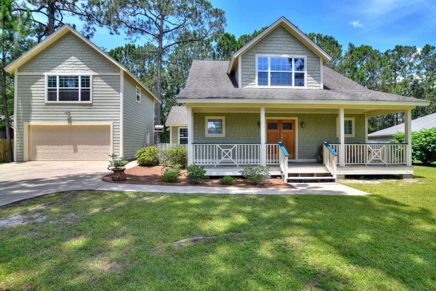 Price Adjustment! Beautiful custom built home with separate in-law suite in Colony Club. Quality construction with 2x6 walls on main floor, travertine marble floors, vaulted tongue and groove ceilings, antique interior doors, stained glass windows, big covered front porch, huge screened porch in back... Main house has 3 BR's including 1st floor master with cathedral ceilings,  luxurious master bath w/jetted tub and separate shower and access to screen porch, open floor plan, cozy fireplace in LR. 2 large BR's upstairs with Jack & Jill baths. Detached garage with finished studio/ in-law suite above. Lots of storage, big 100' x131' yard that backs up to conservation property and no home owner's association. Easy access to Colony Club from Nautilus St.