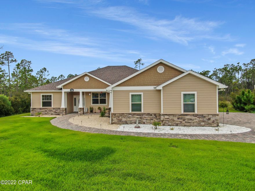 CURRENTLY UNDER CONTRACT, SELLER WILL CONSIDER BACKUP OFFERS. Beautiful custom built home in a gated community w/boat ramp, community pool & RV/boat parking. Situated on over a half acre lot! As you walk in you'll love the tile floors throughout, large living room & dedicated office w/French doors. The kitchen is a chefs dream & features crisp white cabinetry, large kitchen island, pantry, breakfast bar, double oven, & granite counter tops. The dining area will fit a large table. The main bedroom is enormous & features a full bathroom w/a walk-in shower, double sink vanity & large walk-in closet.  You'll love the laundry room with tons of cabinets, storage & built in wash sink. Outside features a huge screened in patio & separate covered patio overlooking the lush green yard.