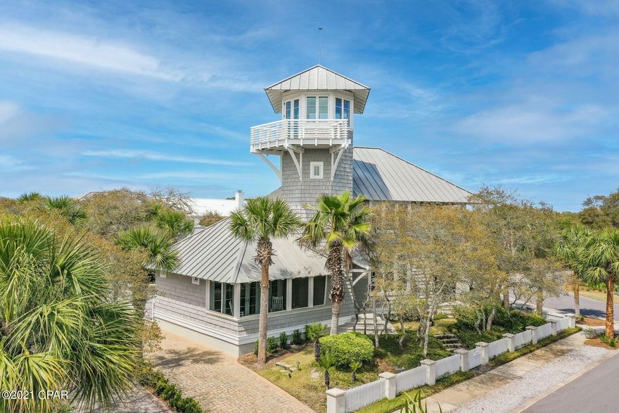 CURRENTLY UNDER CONTRACT, SELLER ACCEPTING BACKUP OFFERS. Designed by the award-winning Dungan Nequette architecture team, the home has been featured in Atlanta Homes and Coastal Living magazines, and highlighted twice on HGTV. The stunning unique design of this nautical beach home is welcoming and serene. Outside, you'll first notice the beautifully manicured landscaping. Once inside, you're greeted by the custom design of the carefully crafted hardwood flooring and an eye-catching 3 story spiral staircase. Ideally situated adjacent to the iconic Carillon Bell Tower, from the top floor you have panoramic views of the picturesque community and bell tower. Gulf views are rare in Carillon, but this home's lookout tower provides a beach facing balcony for you to enjoy the Florida sun. Each of the 3 bedrooms in the main residence offers an ensuite bathroom, with private balcony access from the master suite. This never-before rented home also includes a separate 1-bedrooom carriage house for added privacy and comfort for your guests. Settled on the footpath to the beach, you have direct access to the 7 beach pavilions, each one unique from another, leading to the emerald water and pure white sand. After enjoying a day at the beach you can either wind down in your second floor Florida Room, on your balcony swing, or in your upscale kitchen preparing a family meal on your commercial quality gas range. The French Doors in the dining area invite the outside in for a truly relaxing salt air experience. Not only will you be able to enjoy the Gulf front pool in this community, but you are just steps away from the famous restaurants and shops located in Carillon Beach. Whether you're playing tennis or basketball in Bellview Park, or taking an evening stroll down the promenade, this house is perfect for someone looking to experience a blissful lifestyle.
