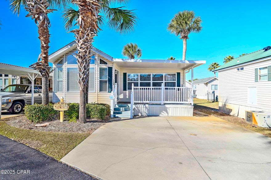 Your dream property awaits you at Emerald Pointe Resort located in Panama City Beach, Florida! This charming beach home is conveniently located close to the club house, main pool and spa area. Step inside to discover a spacious living room, 2 bedrooms, 2 bathrooms, a dining area, an open kitchen complete with breakfast bar, and a master suite with a nice sized walk-in closet. Enjoy the serenity of the open patio at the back of the home for relaxing and entertaining or sip your coffee from your covered front porch. The home also includes a nice sized storage building, and a large lot with room to add on. Recent updates include Park Model Roof 2020, HVAC 2022. This property is being sold fully furnished making it an ideal choice for a primary residence, a second home, or an investment property. Emerald Pointe Resort is a gated community nestled in the heart of Panama City Beach, just minutes from restaurants, shopping, and the world's most beautiful beaches. Engage in the community's fantastic amenities, which include a large clubhouse, exercise room, shared library, two swimming pools (one heated seasonally), a hot tub, a serene lake with a boardwalk, and a shuffleboard court. Your HOA fee covers water, sewer, garbage, and lawn service, ensuring you enjoy a hassle-free living experience. (WOW is running fiber optic cable in the community, and when complete, Wi-Fi will be included with your quarterly HOA Fee) This charming property won't last long—schedule your showing today and make it your perfect beach retreat! All information is approximate and should be verified by buyer if important.