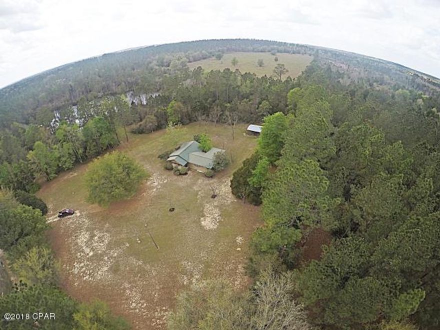 This is one of the nicest parcels of land in Washington County that I have seen!!! There is a 2 BR/1.5 BATH updated home w/open living room/dining room, kitchen w/custom built cabinets, the other Bedroom has a sitting room & 1/2 Bath w/a private entrance, the land has a 3 acre spring fed, stocked pond and 18 yr. old planted pines all on 20 ACRES!!!  The property has plenty of paved road frontage on Hwy 79 and frontage on Leavin's Road. ADDITIONAL PROPERTY CAN BE PURCHASED THAT INCLUDES ABOUT 70 ACRES IN ROLLING HILLS OF PASTURE THAT IS FENCED & CROSS FENCED PRESENTLY W/COWS ON IT AND A WELL W/WATERING TROUGHS AND 29 ACRES OF 18 YR. OLD PINES. AND WILL SELL HOUSE AND 10 ACRES, WHICH IS WHAT THE CURRENT CONTRACT COVERS.