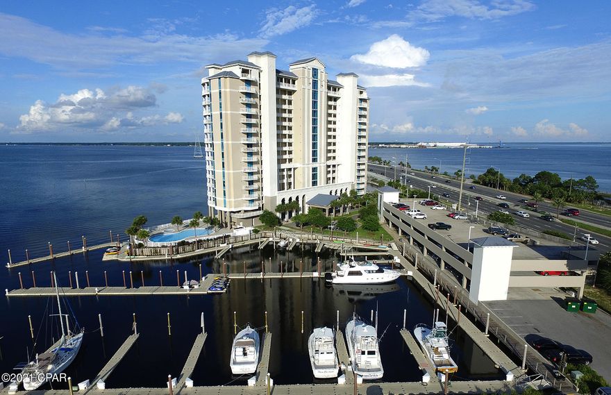 CURRENTLY UNDER CONTRACT, SELLER ACCEPTING BACKUP OFFERS.  Welcome Home.  Marina Landing is a premier bay-front residence.  No short-term rentals.  Live at the beach without having to fight the traffic.  Amenities include a bay-front pool and hot tub, gym, and beautiful common areas.  Paddle board, kayaking and fisherman's paradise.  Boat slips and boat rentals available next door.  Marina Landing #504 offers a great floorplan with all rooms facing the bay and a huge covered balcony (447 s.f.).  The unit has recently undergone major renovations including new paint, flooring, appliances, counter tops, fixtures and drapes.  One of the nicest units in the building.  Furnishings not included in price but are negotiable.