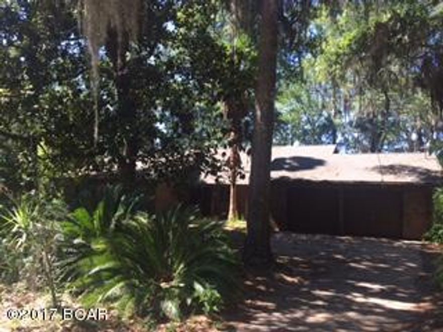 125 WATERFRONT FEET ON BEAUTIFUL DEER POINT LAKE WITH SEAWALL AND DEEPWATER!

FIXER UPPER HANDYMAN SPECIAL...Own a piece of paradise at an unprecedented price for this diamond in the rough.  So much potential and spectacular views. Beautiful lot over 1/2 acre with mature trees.  Sold as is.  A/C inoperable.  ROOF IS 6 YEARS OLD!  Huge screened porch off back of house, French doors, original hardwood flooring, vaulted ceilings, ample storage...oversized double garage!