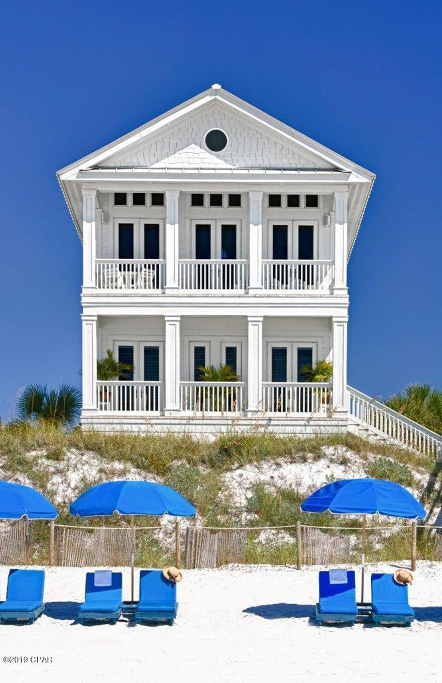 Seaside style meets peaceful privacy in this Carillon Beach coastal classic. Every inch of this home has been carefully manicured by a full time staff and each rental guest hand selected by the owner. With an exceptional past guest database, this home boasts an impressive annual rental history of over 340,000 that can be built upon as the demand for luxury, beachfront vacation rentals in our area continues to grow. Whether considering a strong investment property or a private Gulf front retreat, this remarkable property has the attributes to satisfy the most savvy buyers shopping the Northwest Florida coast. 289 Beachside Dr is comprised of a main house (3471 SQ FT) and an oversized carriage house (960 SQ FT) with two stories of living space. The property in total houses six bedrooms and eight full baths, a stunning courtyard area with heated private pool, multiple beachfront balconies, two full kitchens, two gas fireplaces, and a private elevator that services all floors in the main house. The property sleeps 14-18 guests, with 5 King suites and separate baths to service each room.