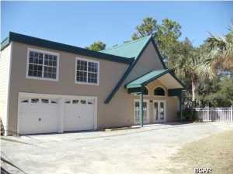 Waterfront foreclosure on Bayou. This 4 bedroom 3 bath home is located close to Scared Heart Medical center, incredible shopping, eateries, and best of all beautiful gulf beaches. This home has been recently remodeled with travertine tile, granite countertops, and stainless appliances. Two master suites, and room for the whole family. The Second floor has a two bedroom lockout unit, with a separate entrance. Nice large lot and did I mention waterfront with two boat slips.